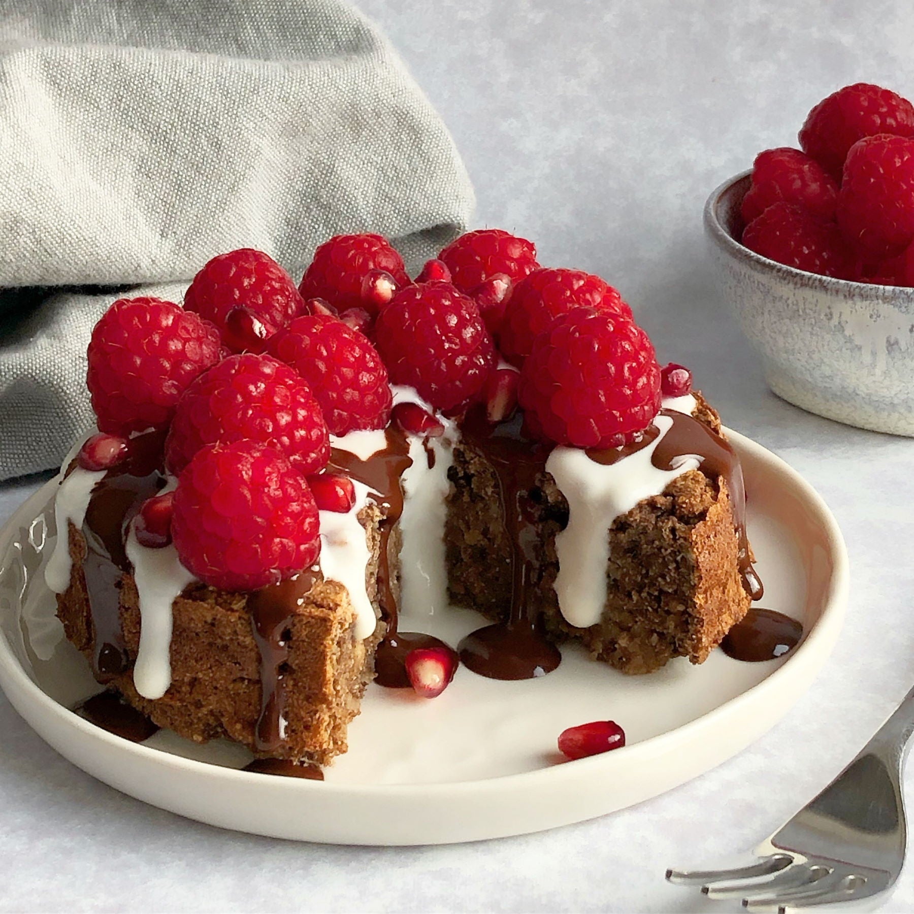 Vegan Dark Chocolate Buttons on Raspberry Cake